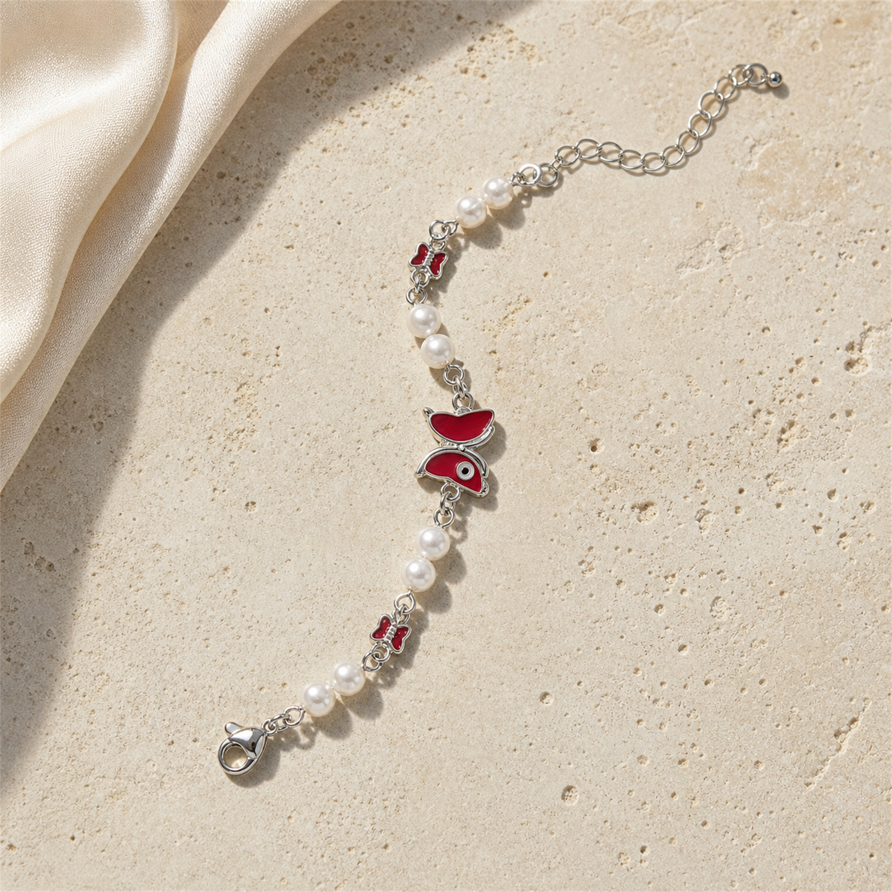 Silver Evil Eye Rakhi Bracelet with Pearls & Butterfly Charm – Nazar Protection Bracelet | Labh Ethnica