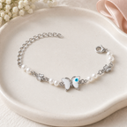Silver Evil Eye Rakhi Bracelet with Pearls & Butterfly Charm