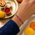 Pink Swastik Rakhi for Brother – Handcrafted Auspicious Beaded Bracelet for Raksha Bandhan | Labh Ethnica