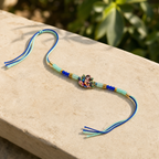 Bal Gopal Krishna Rakhi – Handcrafted Enamel Deity Beaded Tassel Bracelet for Raksha Bandhan | Labh Ethnica