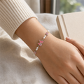 Silver Evil Eye Rakhi Bracelet with Pearls & Butterfly Charm – Nazar Protection Bracelet | Labh Ethnica