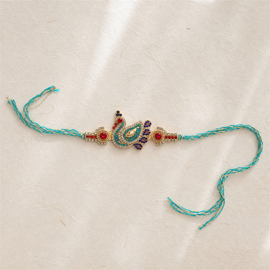 Decorative peacock feather rakhi on a beige background